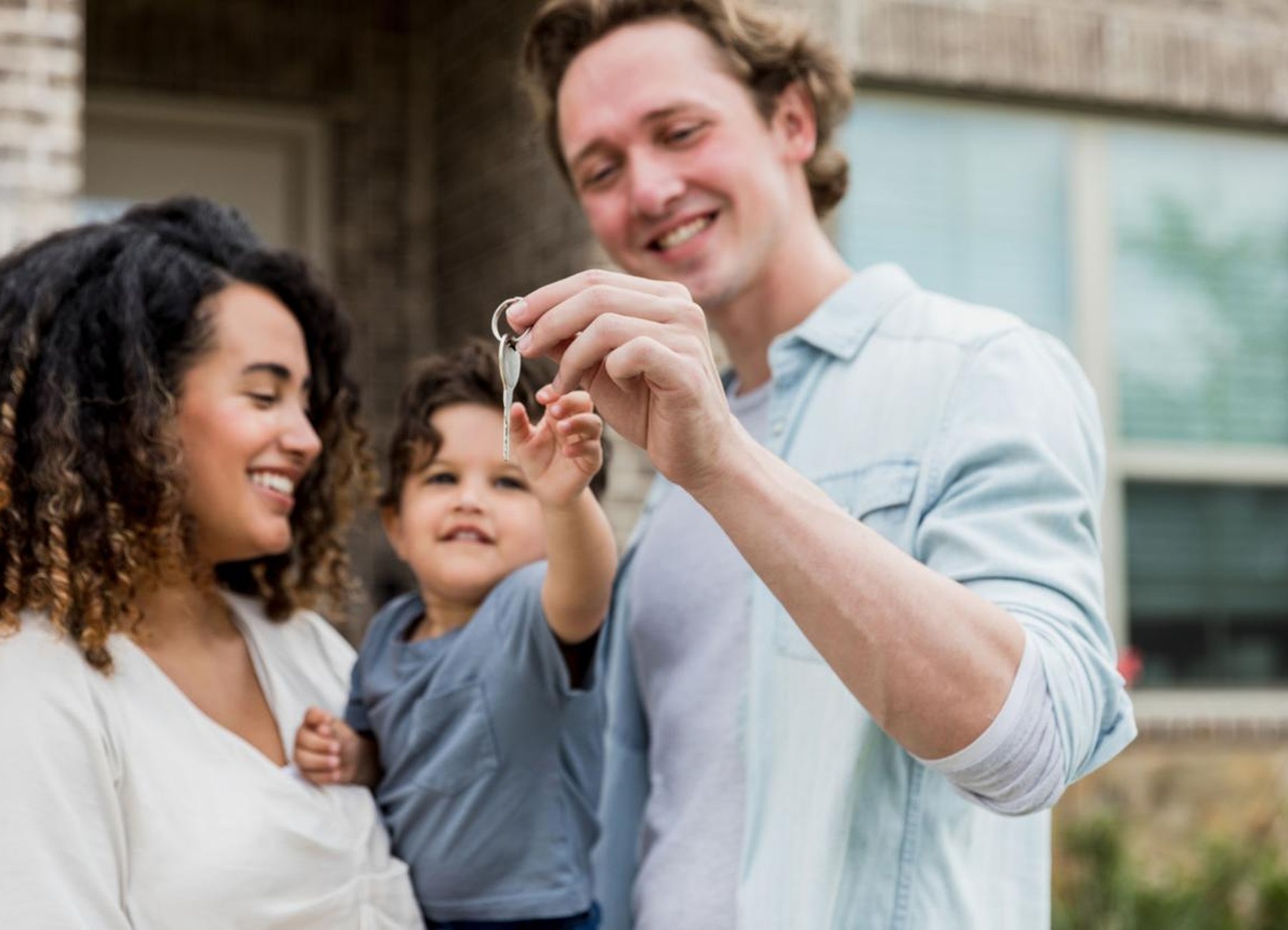 Family receiving keys to their home
